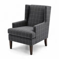 Poltrona in tessuto a quadri grigio scuro con gambe in legno
